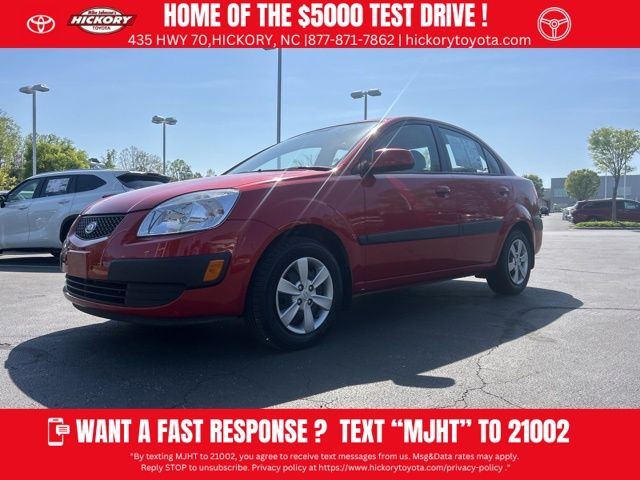 Tropical Red 2009 Kia Rio LX Sedan Front-Wheel Drive 4-Speed Automatic Overdrive