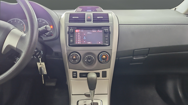 Used 2013 Tropical Sea Metallic Toyota LE image 13