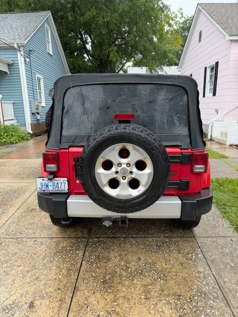 Used 2014 Red Jeep Unlimited Sahara image 29