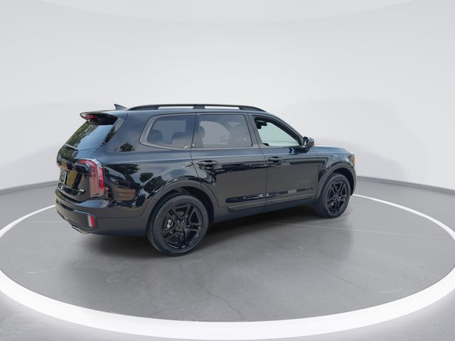 Used 2025 Black Kia EX X-Line image 9