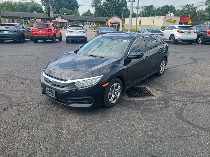 Used 2016 Honda Civic LX with VIN 19XFC2F50GE087075 for sale in Massillon, OH